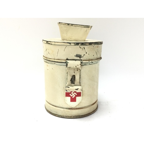 1546 - WW2 German D.R.K Red Cross Collection Tin. The metal tin painted cream with a Red Cross and Swastika... 