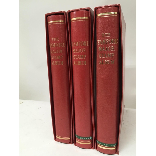 1703 - Three red Stamford Major stamp albums containing channel island stamps and other world stamps (a lot... 