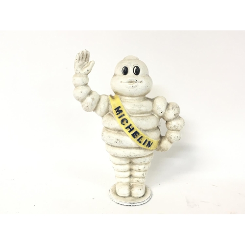 1808 - A reproduction Michelin man money box, approximately 22cm tall