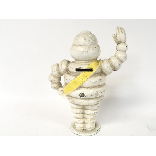 1808 - A reproduction Michelin man money box, approximately 22cm tall