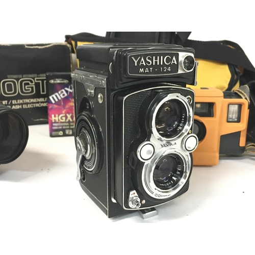 1810 - A collection of vintage cameras and film cameras including a Yashica MAT-124, Yashica FX-3, Canon AS... 