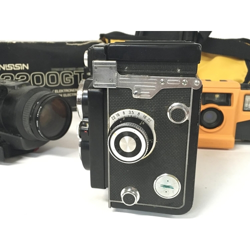 1810 - A collection of vintage cameras and film cameras including a Yashica MAT-124, Yashica FX-3, Canon AS... 