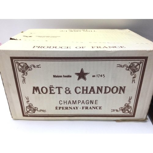 1948 - A box of unopened MoÃ«t champagne with a mahogany tantalus & decanters, 15cm x 32cm.