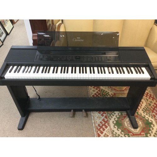 1974 - A Clavinova CVP-8 keyboard and stand with associated user manuals.