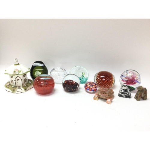 1976 - A collection of vintage glass and stone paperweights including a limited edition flower green paperw... 