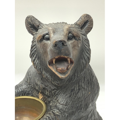 700 - A Black Forest carved wooden bear tobacco jar, mid-19th century, Swiss, the head and shoulders formi... 