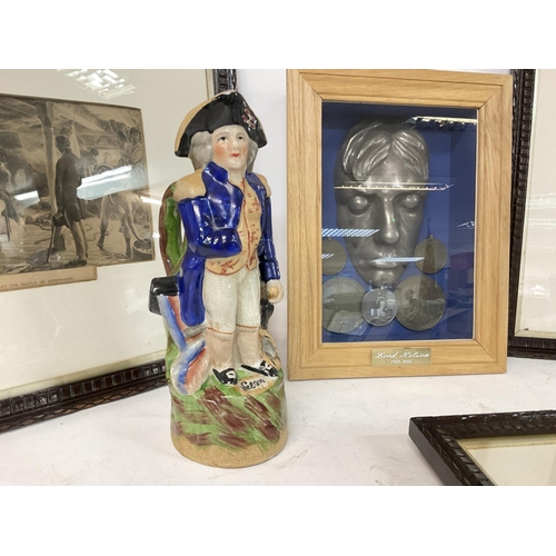 724 - A collection of Lord Nelson ornaments including a ceramic Toby jug, a display case with Nelson assoc... 