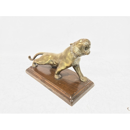 736 - Brass tiger ornament made in Almazan, Spain. Base size approximately 12x23cm