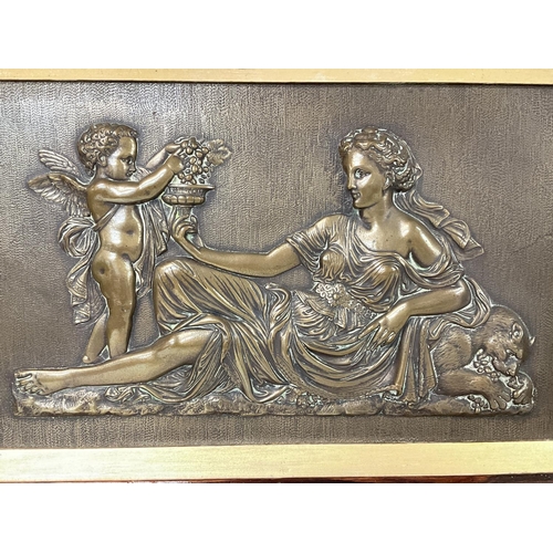 737 - A bronze plaque depicting the Goddess Venus with a Cherub serving grapes. Frame size is 49x55cm appr... 