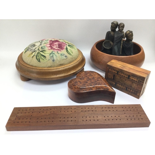 744 - A collection of treen comprising a jewellery box, cribbage boards, a footstool with a cross stitch t... 