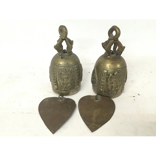 750 - A pair of brass Viking ornaments (23cm tall approx), a pair of Indian brass bells and Continental po... 