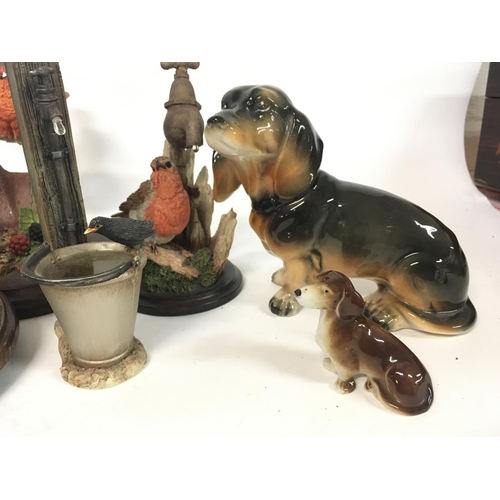 853 - A collection of Country Artist resin birds and ceramic dogs including a Dresden dog