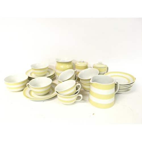 864 - T.G Green yellow Cornish ware tea set including tea plates, breakfast cups & saucers etc