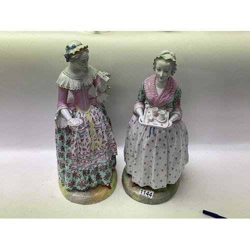 888 - A pair of large 19th Century porcelain figures of ladies maids. 43cm, ( some restoration).