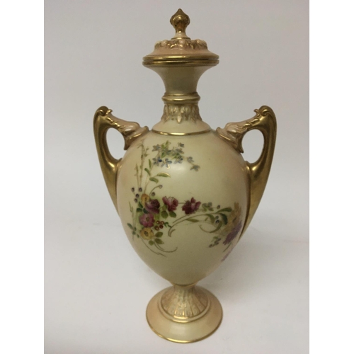 912 - A hand painted Royal Worcester porcelain vase with flowers and foliage and applied gilt height 29cm