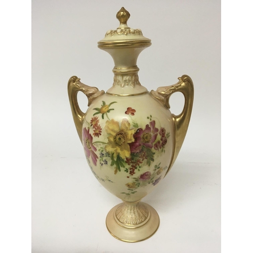 912 - A hand painted Royal Worcester porcelain vase with flowers and foliage and applied gilt height 29cm