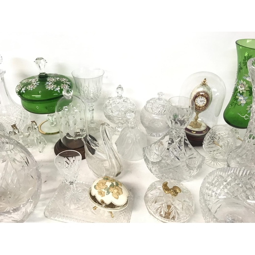 914 - A collection of cut glass ornaments including decanters, glasses