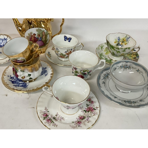 919 - A collection lot of mixed cups and saucers including Aynsley, Mikasa plus a Limage coffee set