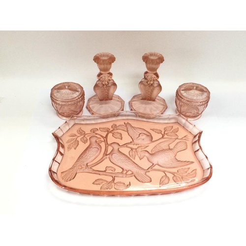 988 - A rare pattern peach glass dressing table set, possibly by Rosiche or Libochive.