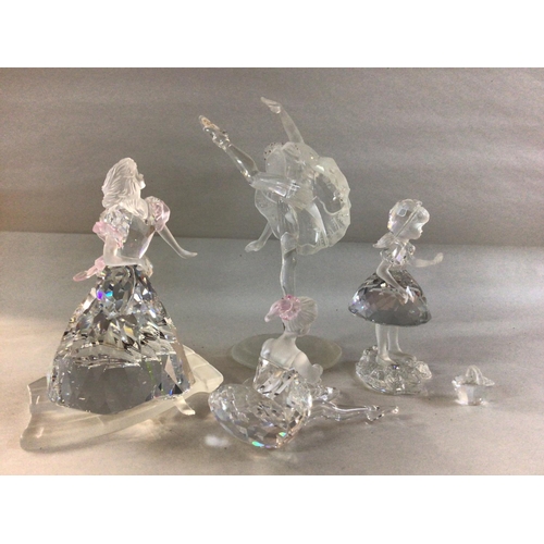 997 - Four Swarovski figures including Cinderella- fleeing with a missing shoe, Two Ballet dancers and a g... 