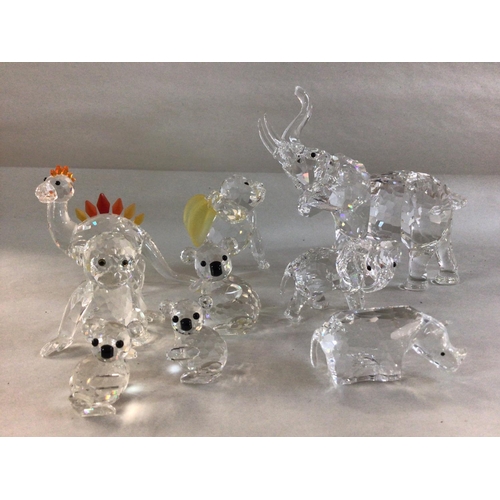 998 - A collection of Swarovski animals including Chimpanzee with bananas, large and small elephants, Rhin... 