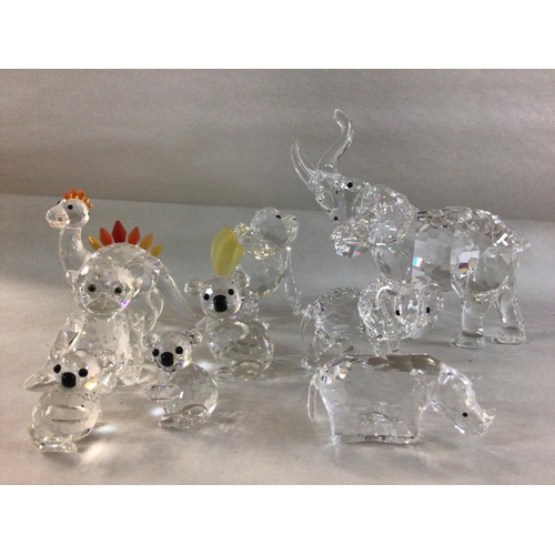 998 - A collection of Swarovski animals including Chimpanzee with bananas, large and small elephants, Rhin... 