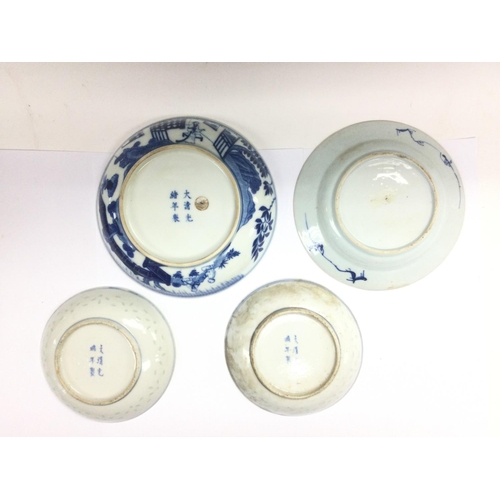 1019 - Four blue and white Oriental dishes, largest diameter approx 18cm. Shipping category D.