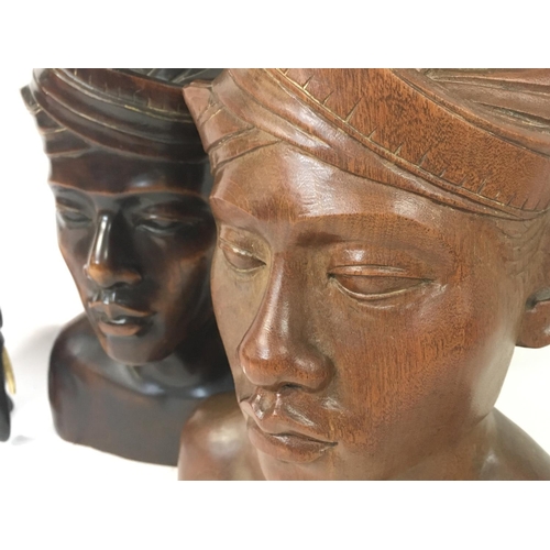 1036 - Indonesian carved busts (approximately 35cm tall) and ebony elephants (15 & 9cm tall)