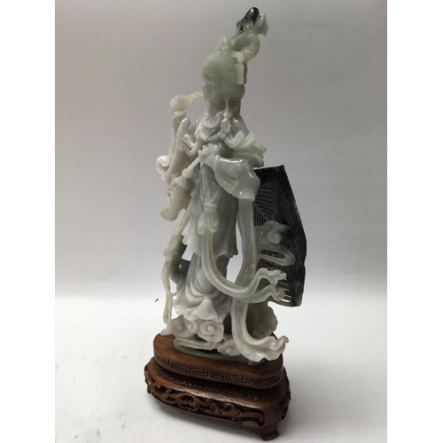 1039 - A boxed and carved soap stone oriental figure of a Goddess, with carved wooden stand