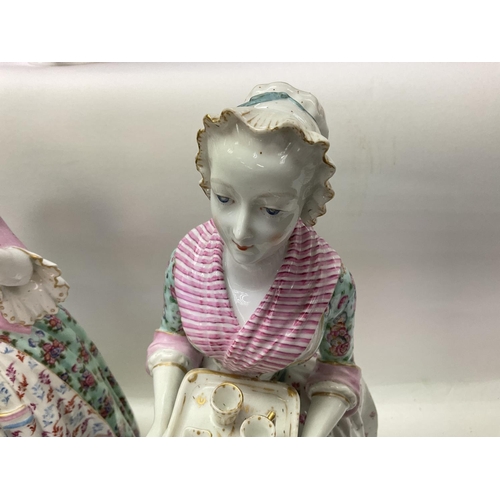 1126 - A pair of large 19th Century porcelain figures of ladies maids. 43cm, ( some restoration).