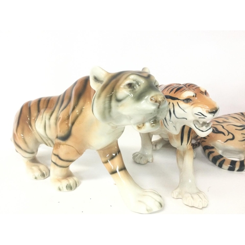 1156 - Made in the USSR porcelain tigers, variating from 22 to 32 cm long approximately.