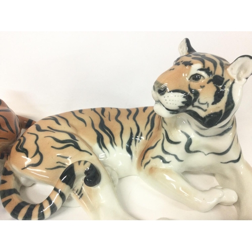 1156 - Made in the USSR porcelain tigers, variating from 22 to 32 cm long approximately.