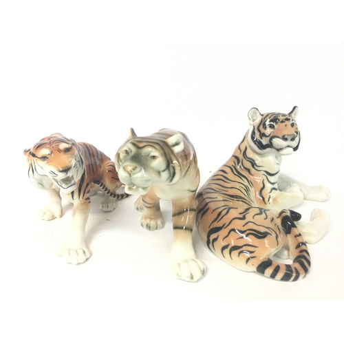 1156 - Made in the USSR porcelain tigers, variating from 22 to 32 cm long approximately.