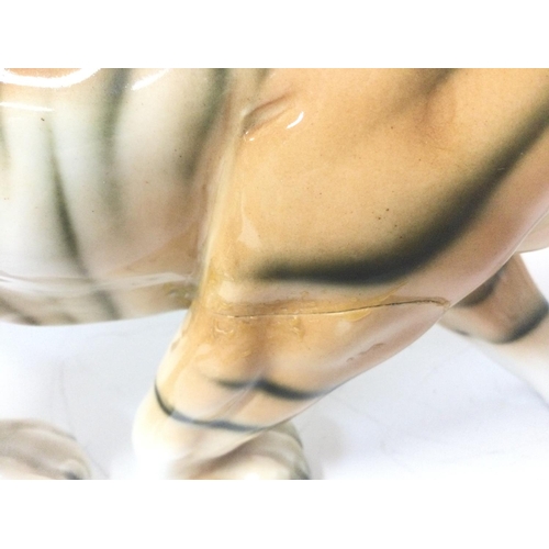 1156 - Made in the USSR porcelain tigers, variating from 22 to 32 cm long approximately.