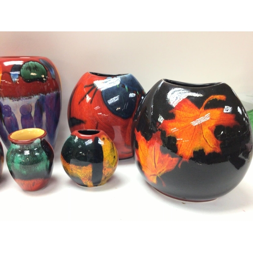 1159 - A collection of modern Poole vases ranging from 10 to 21cm tall