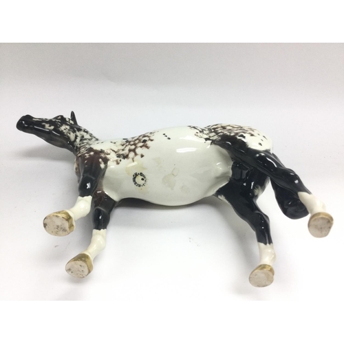 1174 - A Beswick Appaloosa horse figure, approx height 19.5cm. Shipping category D.