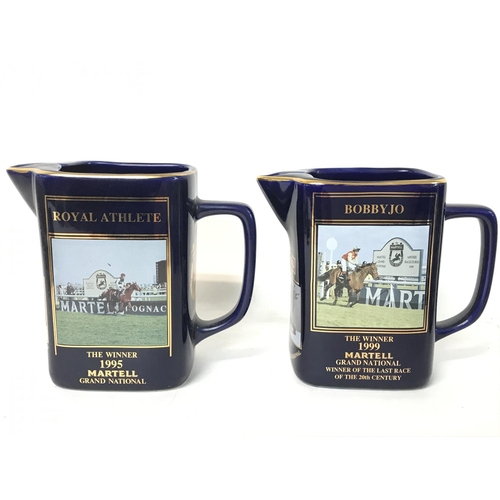 1217 - A collection of Martell Grand National jugs