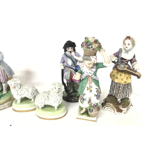 1227 - A collection of early 20th century Dresden porcelain figures including two small sheep and other fig... 