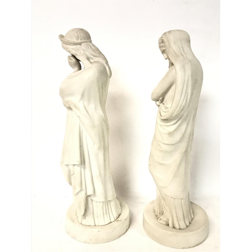 1232 - A pair of Victorian Parian ware figurines, approximately 32cm tall. (D)