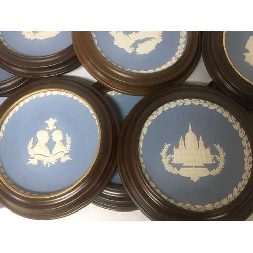 1247 - A collection of Wedgwood Jasperware commemorative plates and annual issues plates some most in mahog... 