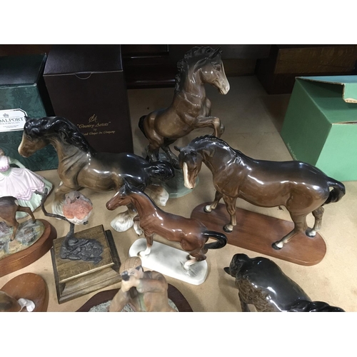 1322 - A collection of Beswick Horses, a Beswick Beagle on stand, a Coalport figure of a lady, a Border Fin... 