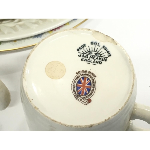 1353 - Two boxes of Elizabeth II and other commemorative ceramics including tea cups, ashtrays, plates etc ... 