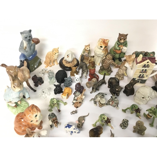 1361 - A large collection of miniature ceramic figured including Wade, Beswick, Beatrix potter, Lenox etc (... 