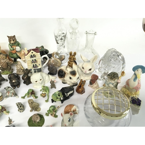 1361 - A large collection of miniature ceramic figured including Wade, Beswick, Beatrix potter, Lenox etc (... 