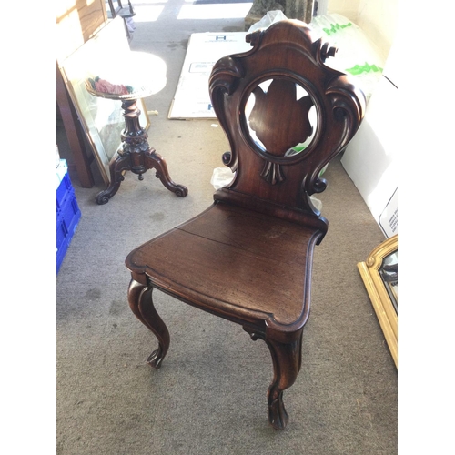 1440 - A Victorian Mahogany hall chair, in need of restoration due to cracks. 42x36x90xm approximately.