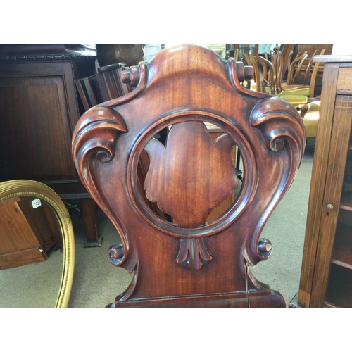 1440 - A Victorian Mahogany hall chair, in need of restoration due to cracks. 42x36x90xm approximately.