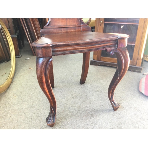 1440 - A Victorian Mahogany hall chair, in need of restoration due to cracks. 42x36x90xm approximately.