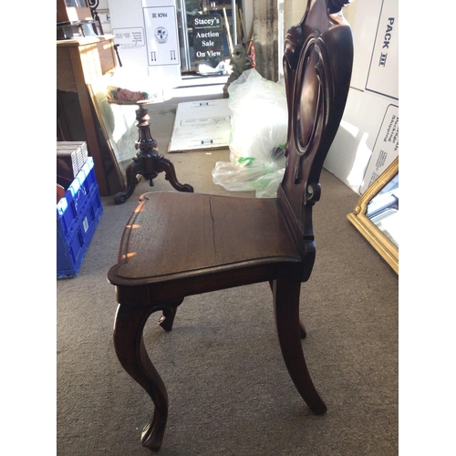 1440 - A Victorian Mahogany hall chair, in need of restoration due to cracks. 42x36x90xm approximately.