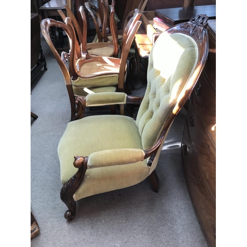 1459 - A Victorian mahogany open arm chair upholstered in green, 56x60x100cm approximately.