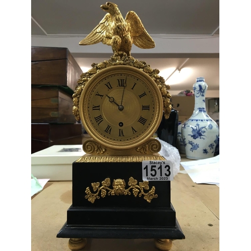 1513 - A Victorian mantle clock, made in London- the dial having Roman numerals, surmounted by a brass eagl... 